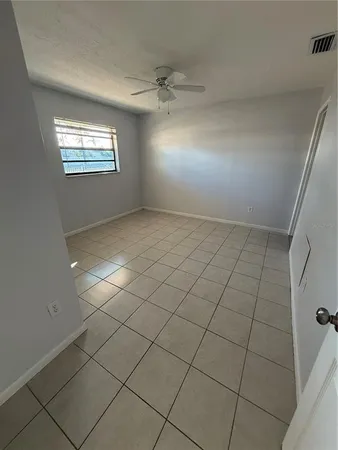 a view of an empty room and window