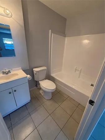 a bathroom with a toilet and a sink