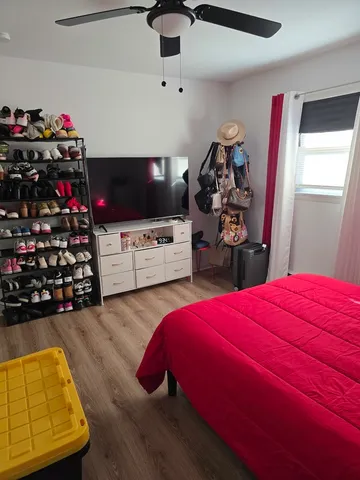 a bedroom with a bed and a tv in it