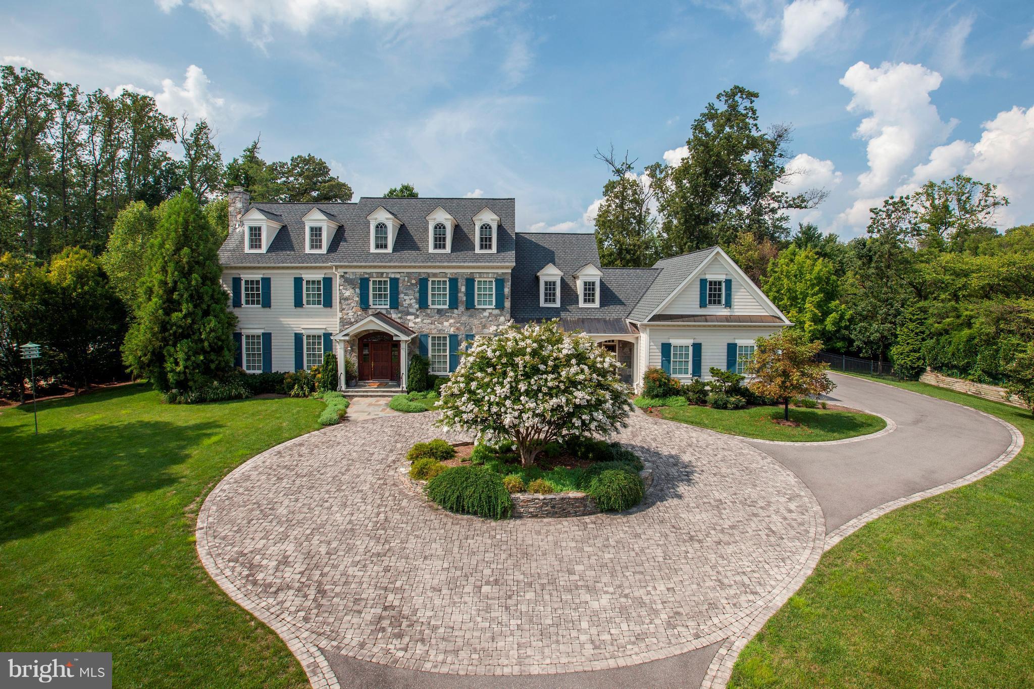 9809 Newhall Road Potomac, MD 20854 - Photo 1 of 37 a front view of a house with garden