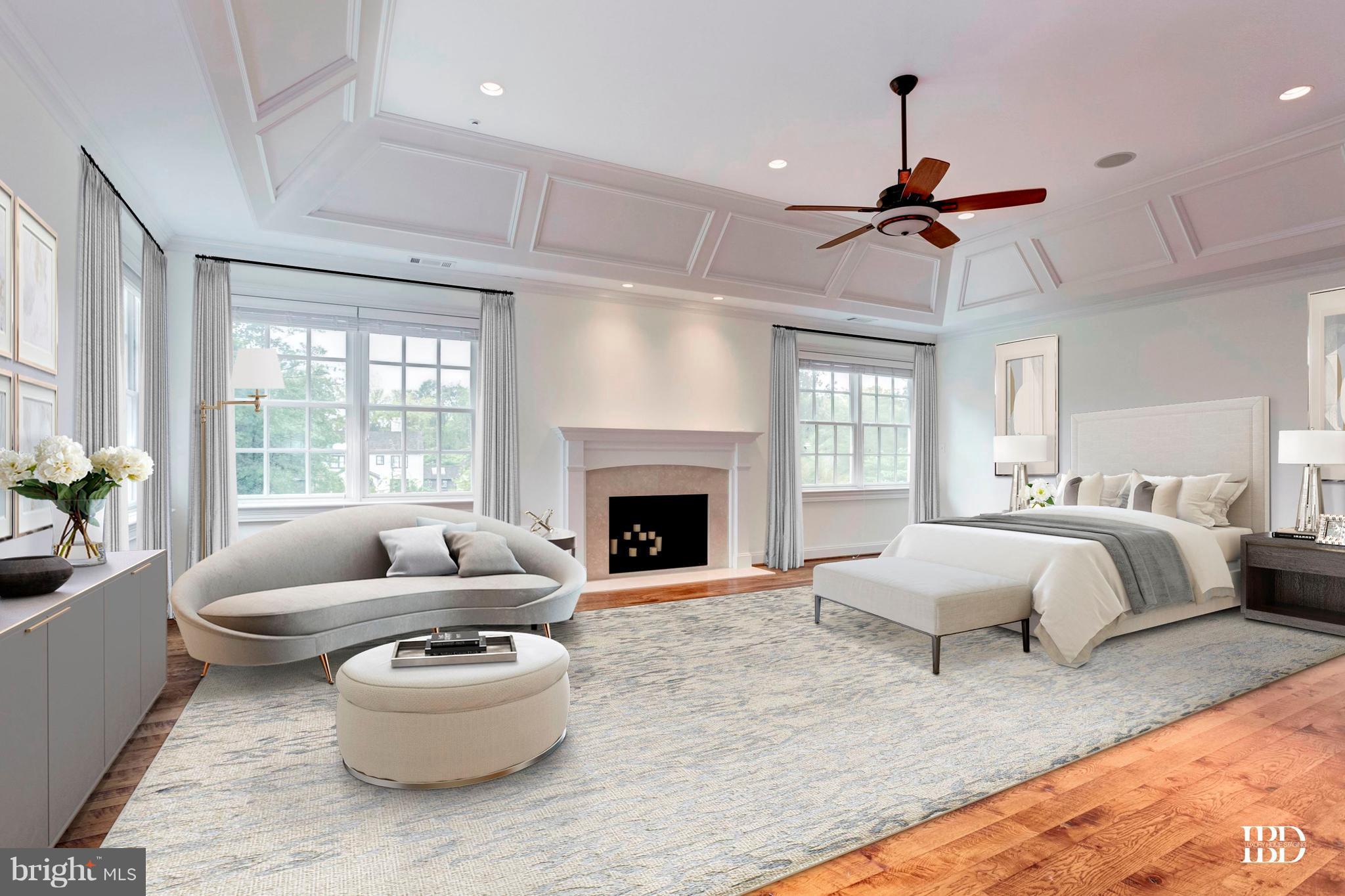 9809 Newhall Road Potomac, MD 20854 - Photo 16 of 37 a bedroom with a large bed and a fireplace