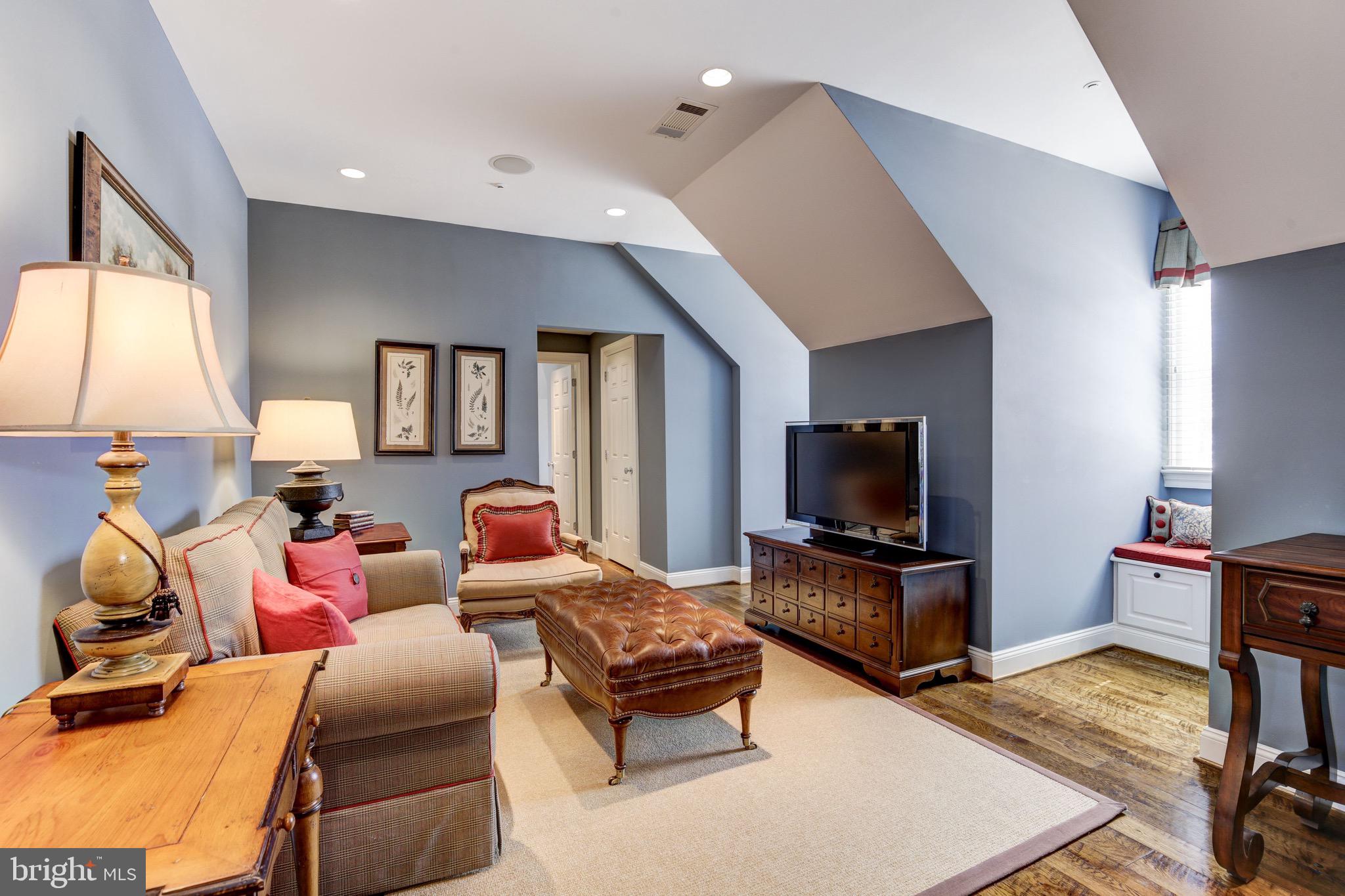 9809 Newhall Road Potomac, MD 20854 - Photo 20 of 37 a living room with furniture and a flat screen tv