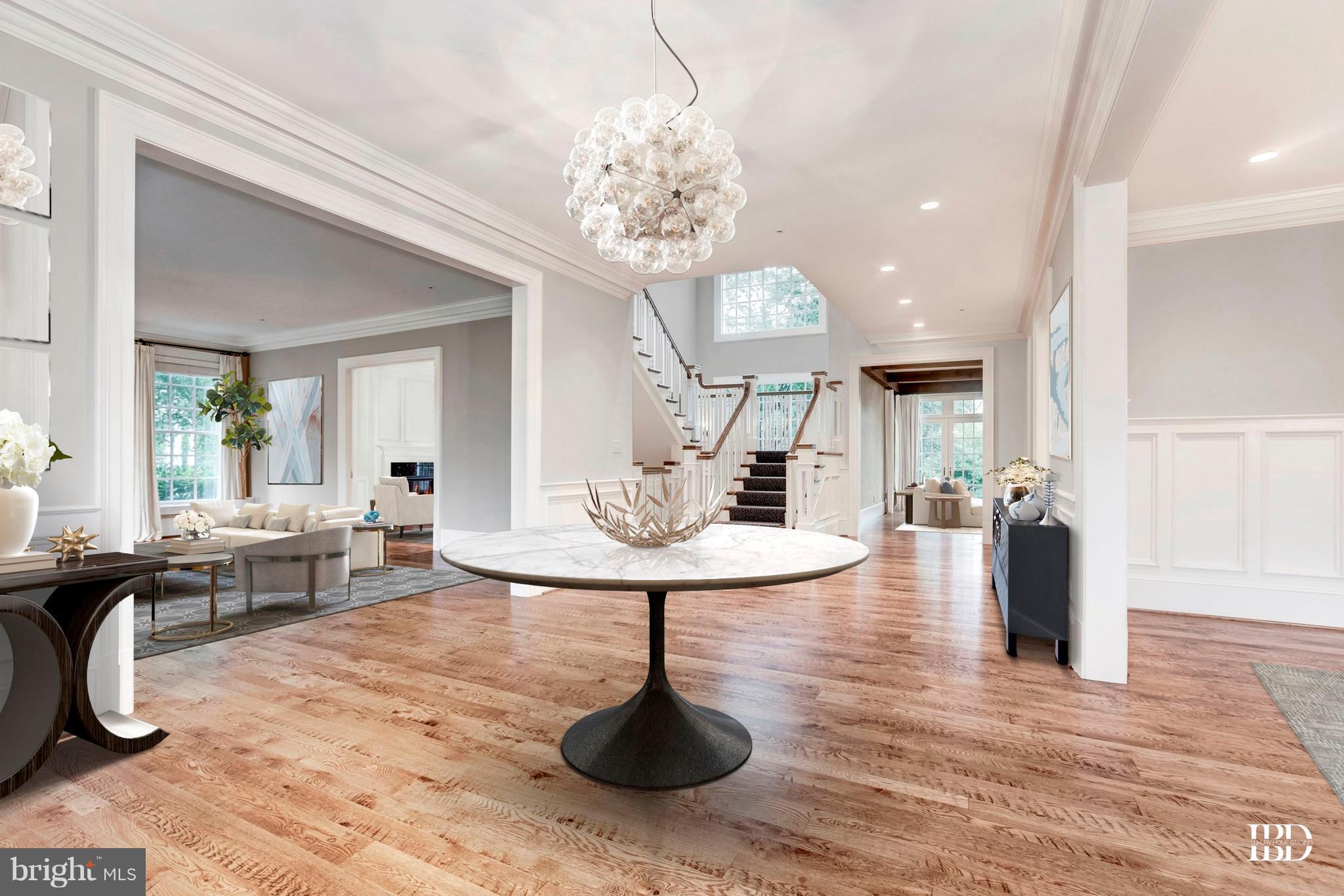 9809 Newhall Road Potomac, MD 20854 - Photo 3 of 37 a living room with fireplace furniture and a chandelier
