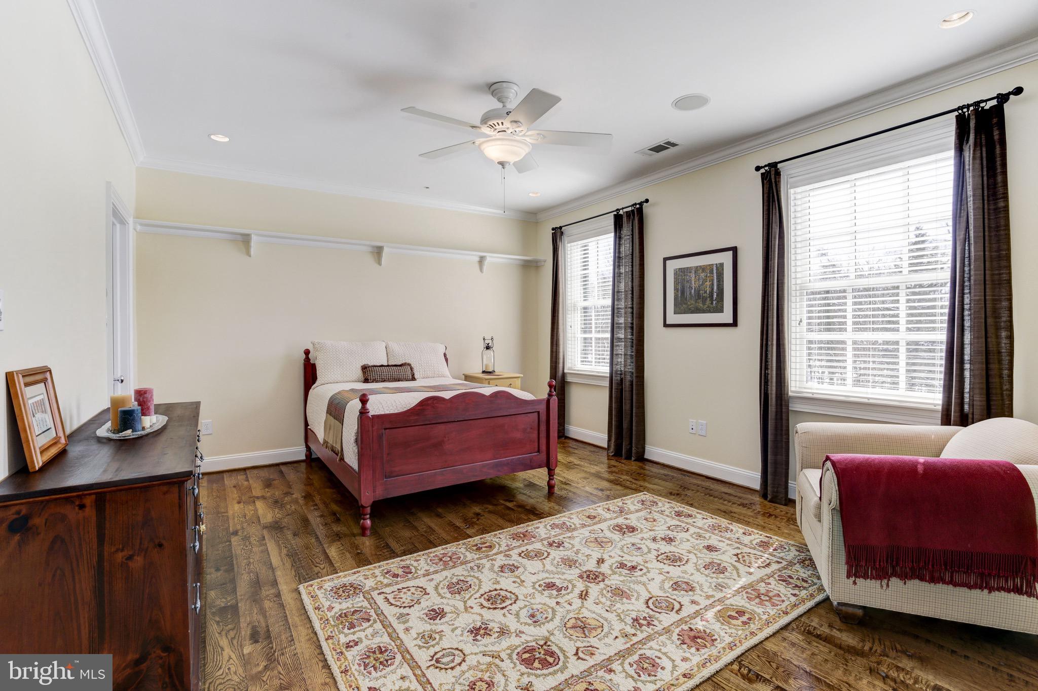 9809 Newhall Road Potomac, MD 20854 - Photo 25 of 37 a bedroom with a bed and wooden floor