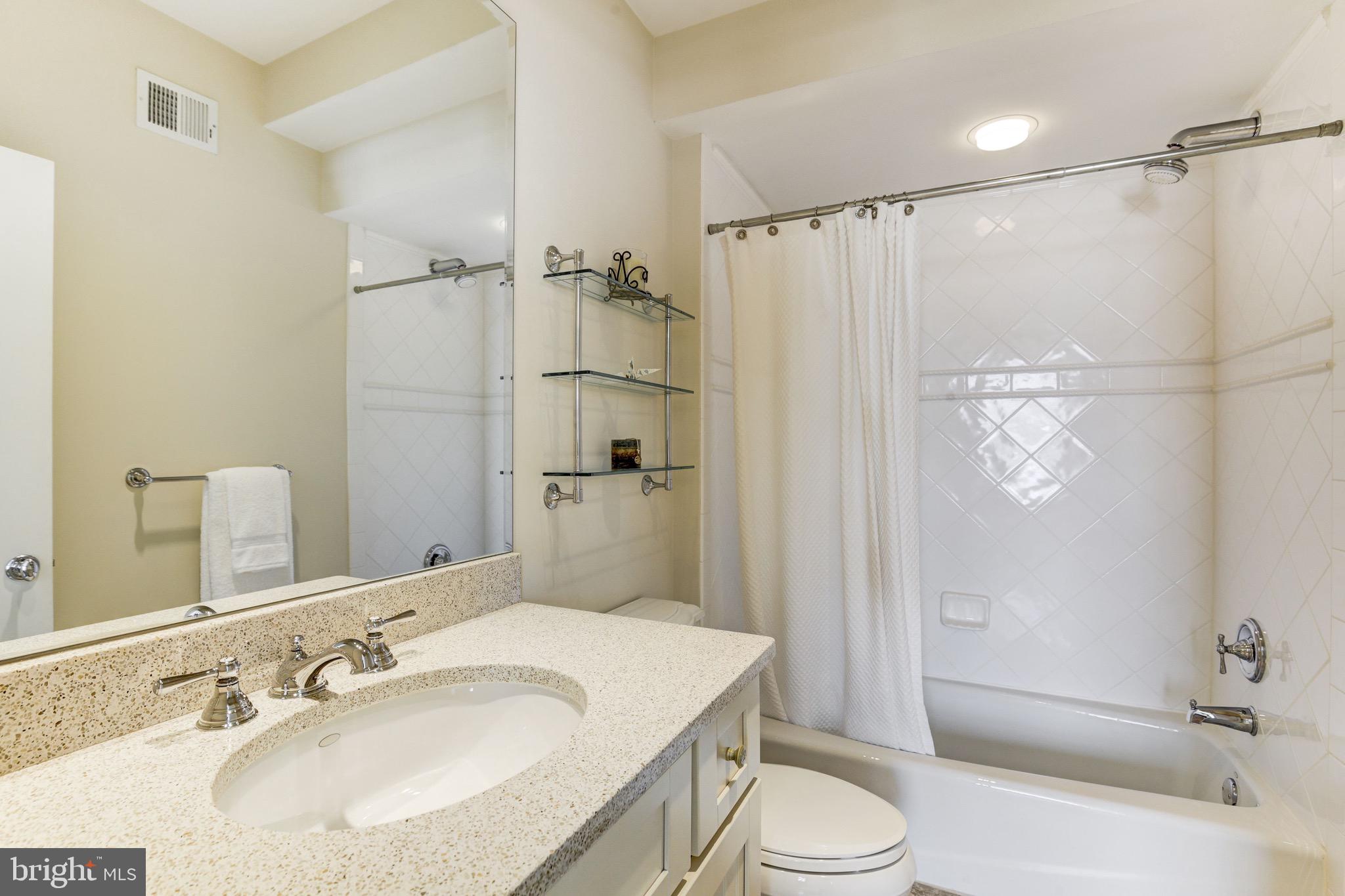 9809 Newhall Road Potomac, MD 20854 - Photo 26 of 37 a bathroom with a sink toilet and shower