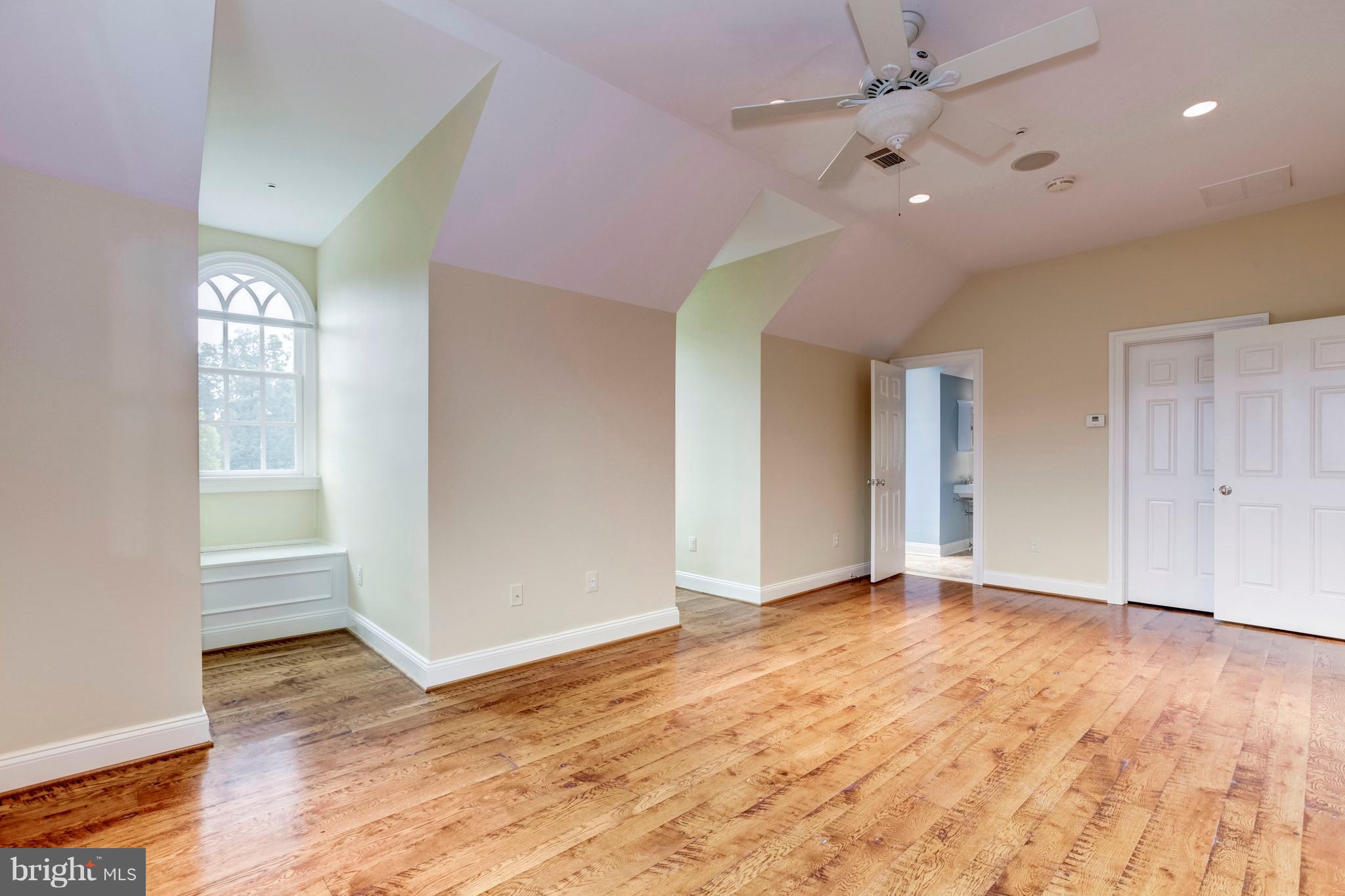 9809 Newhall Road Potomac, MD 20854 - Photo 29 of 37 an empty room with wooden floor and windows