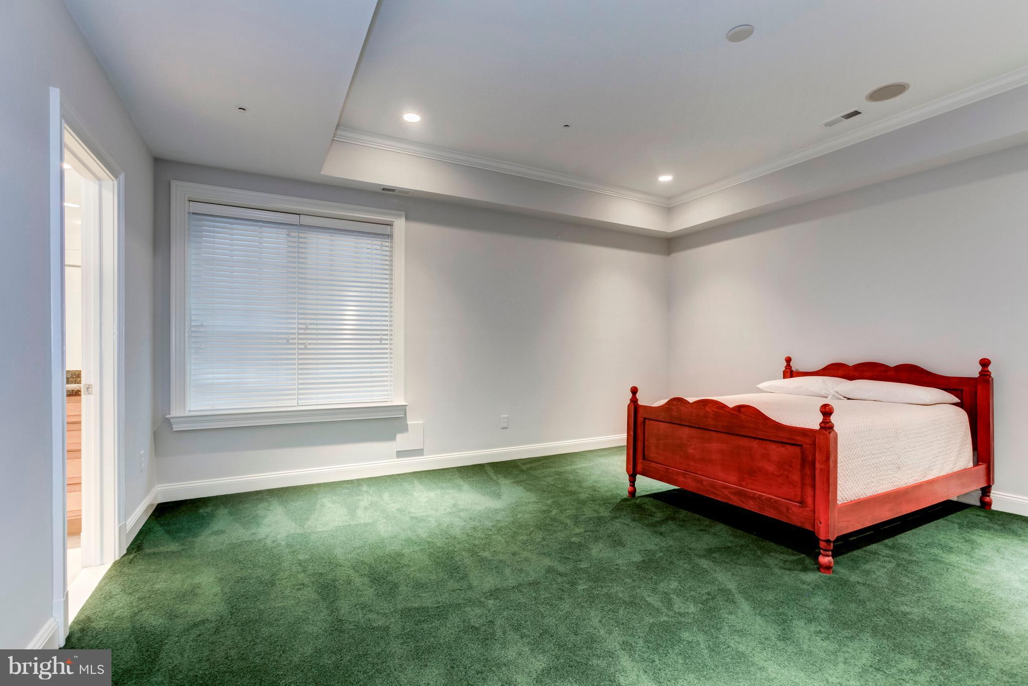 9809 Newhall Road Potomac, MD 20854 - Photo 30 of 37 a room with a bed and a window