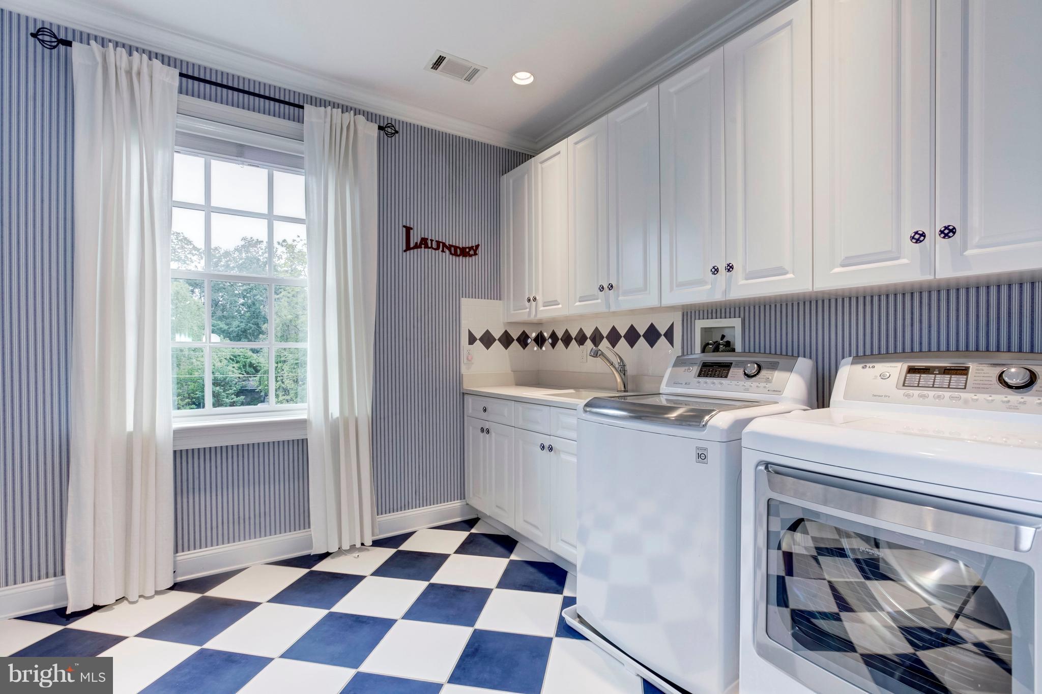 9809 Newhall Road Potomac, MD 20854 - Photo 31 of 37 a utility room with sink dryer and washer