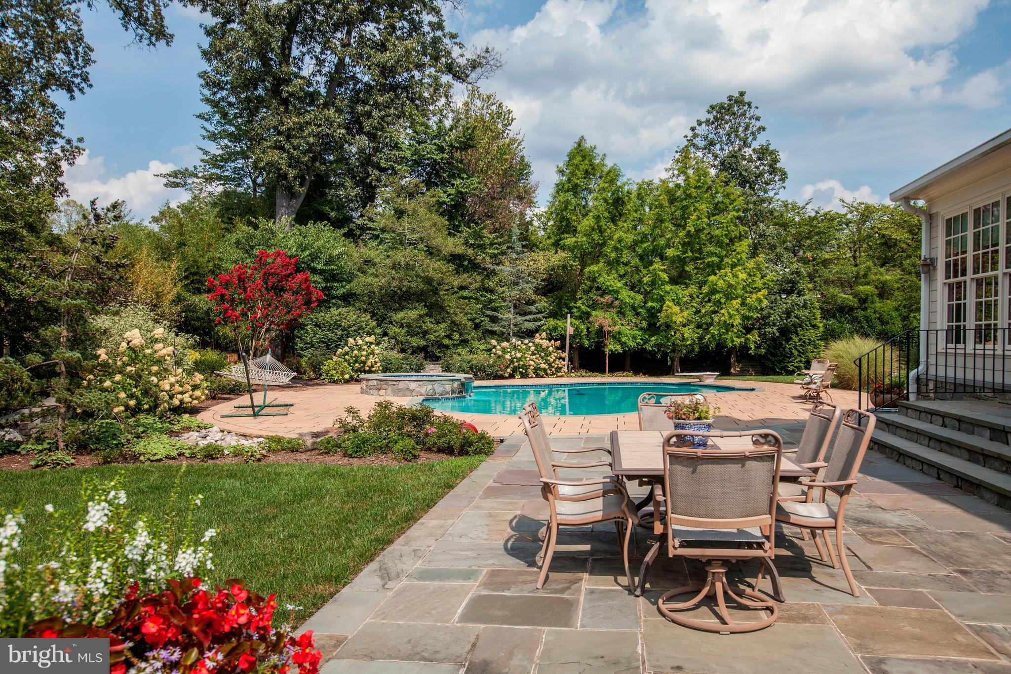 9809 Newhall Road Potomac, MD 20854 - Photo 36 of 37 a view of a chairs and table in the garden