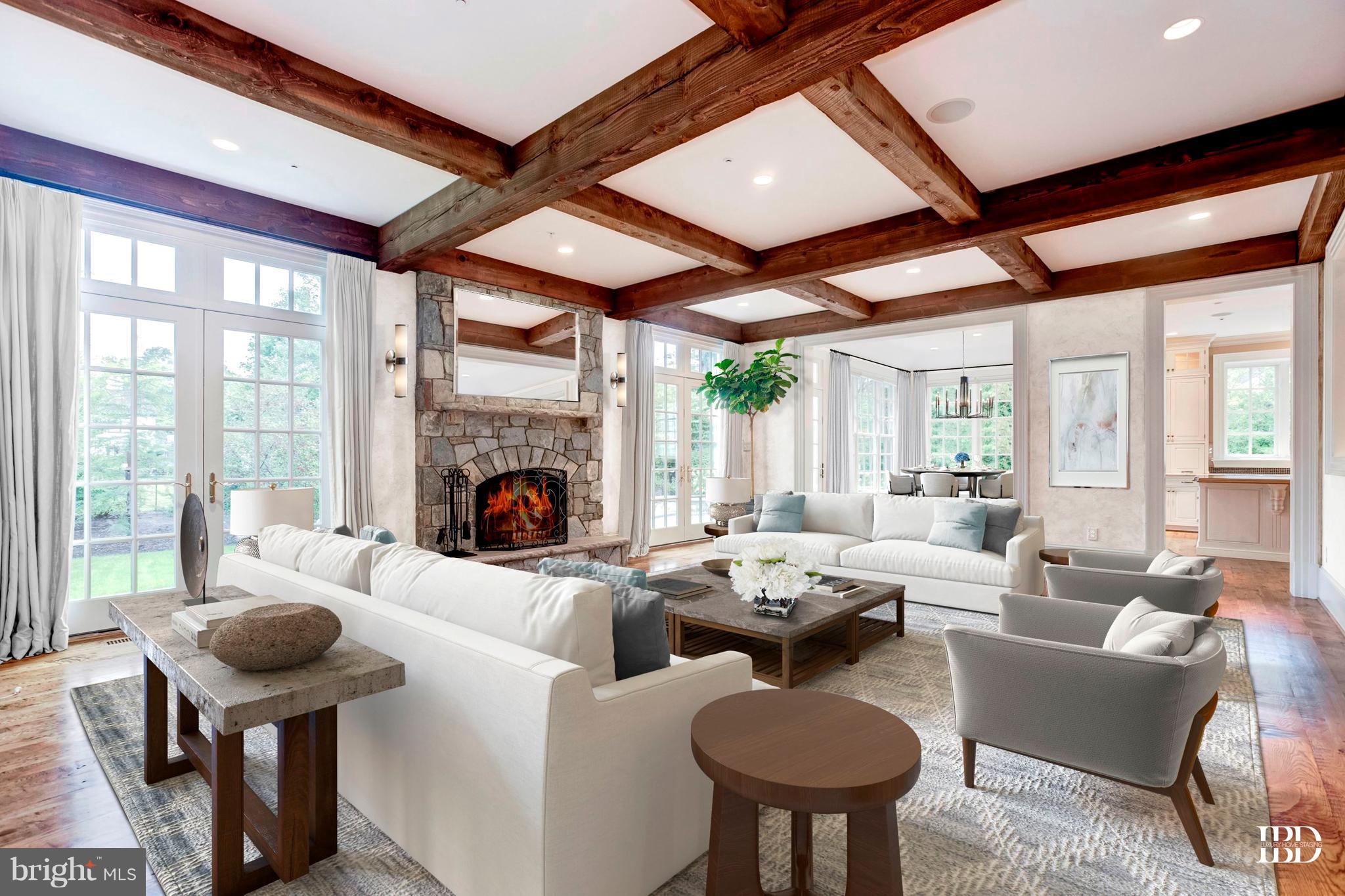 9809 Newhall Road Potomac, MD 20854 - Photo 7 of 37 a living room with furniture a fireplace and a large window