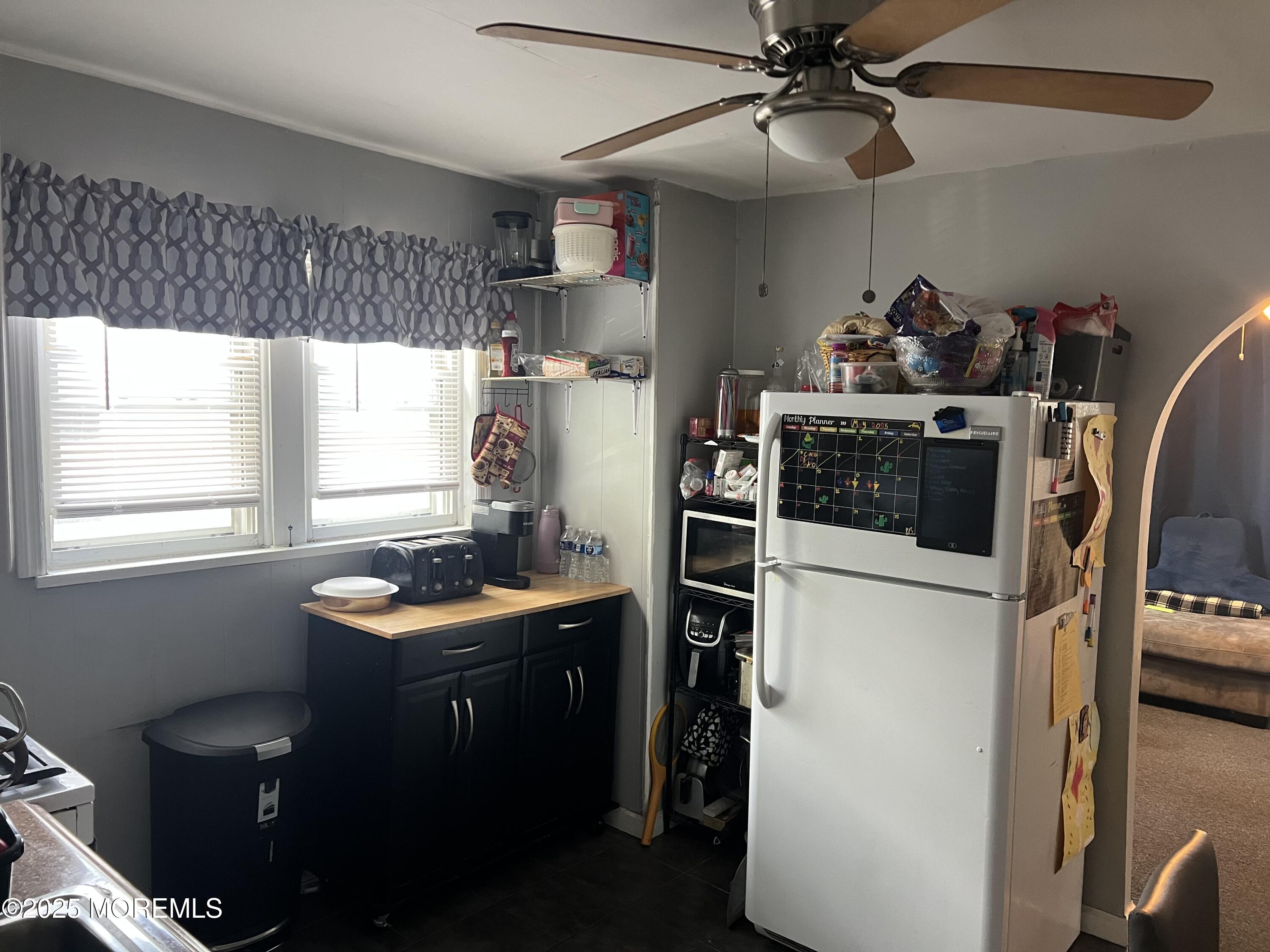 126 Leonard Avenue Neptune, NJ 07753 - Photo 14 of 27 a kitchen with stainless steel appliances a sink a stove a refrigerator and cabinets