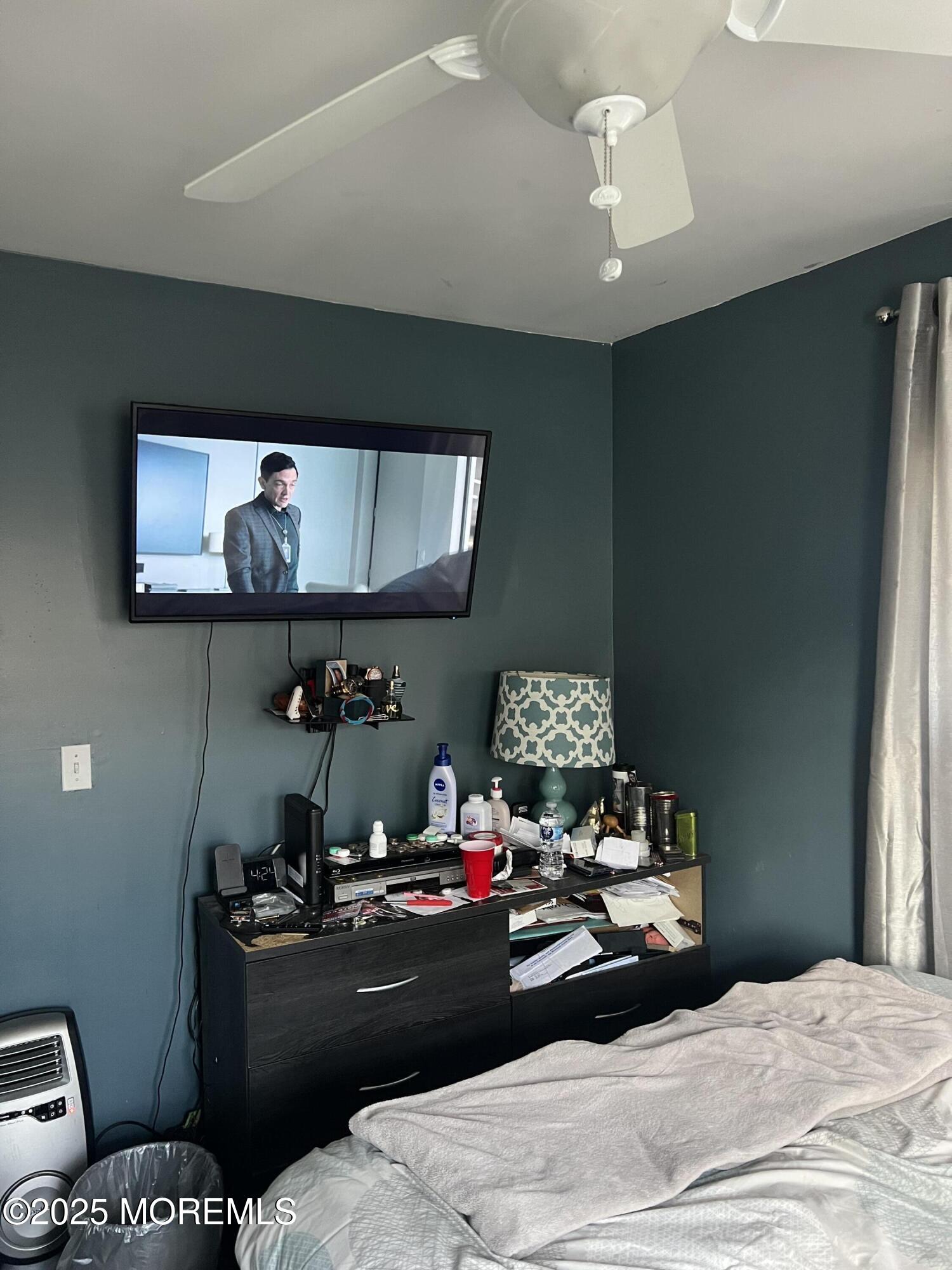 126 Leonard Avenue Neptune, NJ 07753 - Photo 15 of 27 a bed room with a bed window and a chair