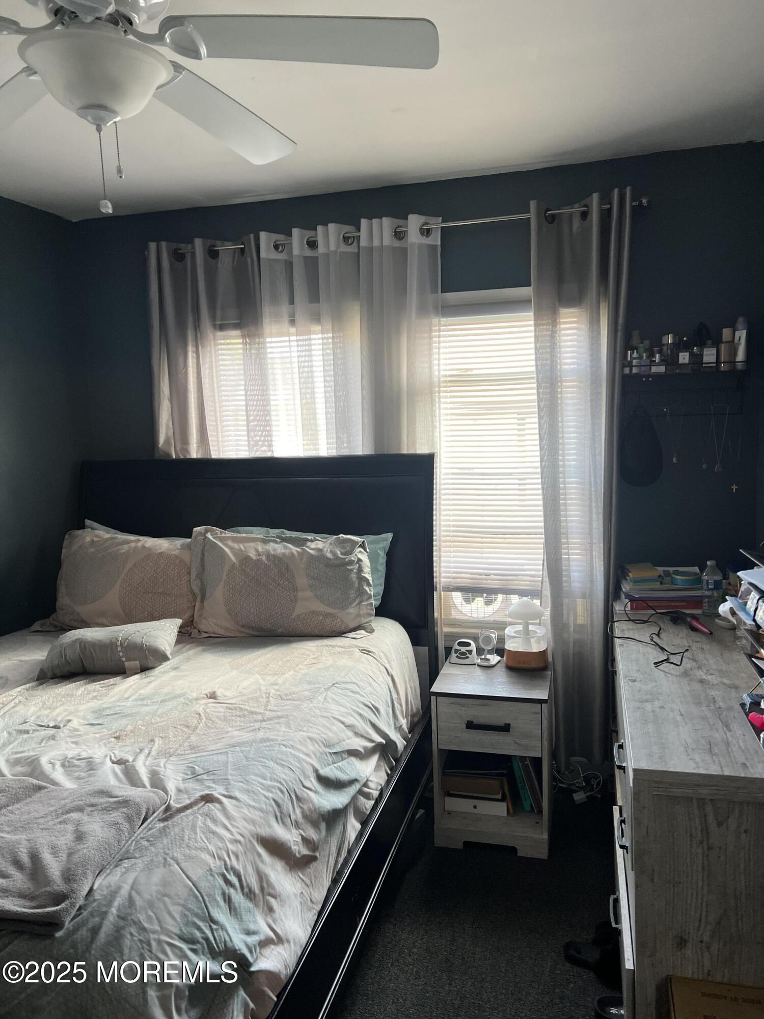 126 Leonard Avenue Neptune, NJ 07753 - Photo 16 of 27 a bedroom with a bed and a window