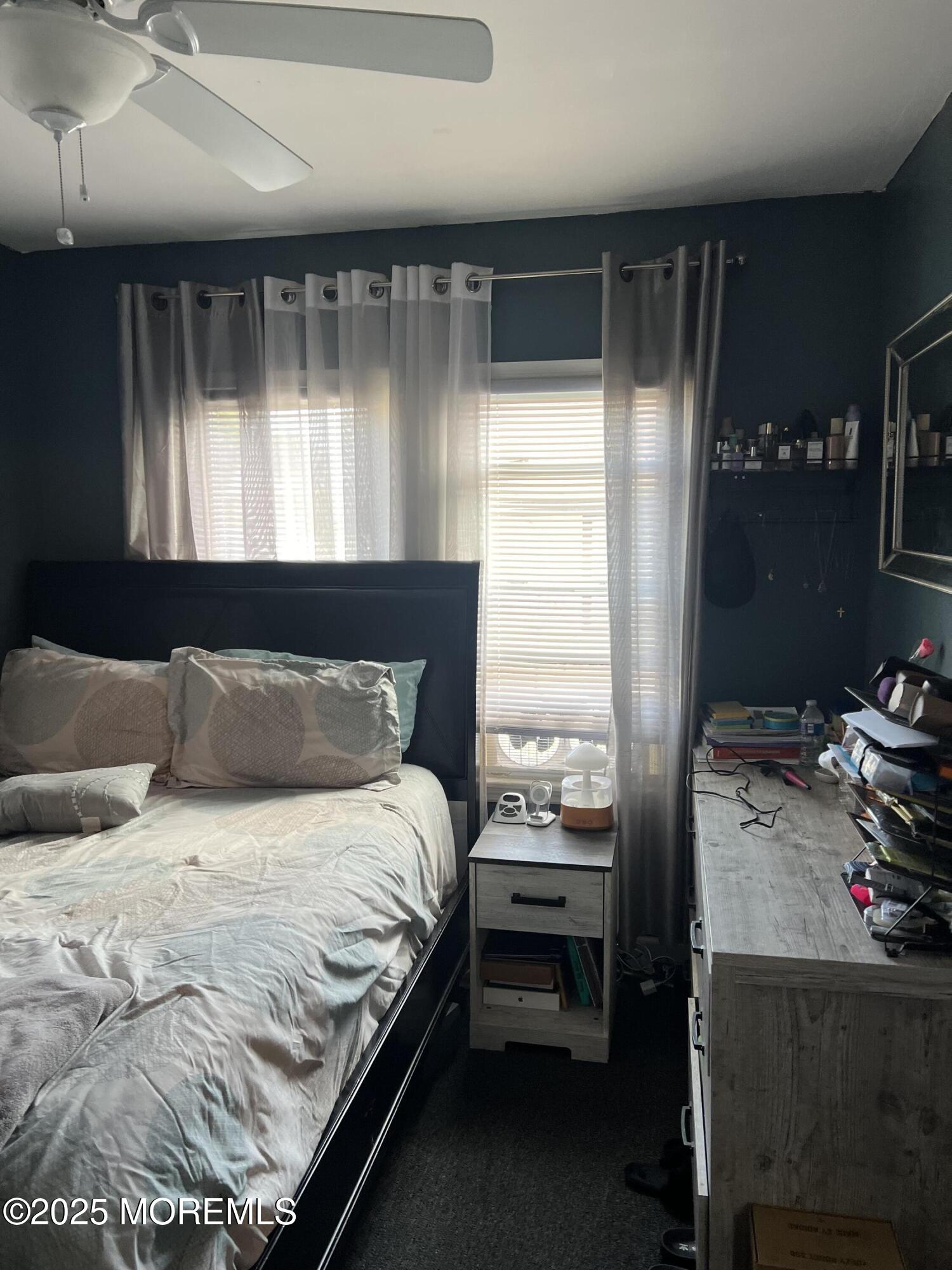 126 Leonard Avenue Neptune, NJ 07753 - Photo 17 of 27 a bedroom with a bed and a window