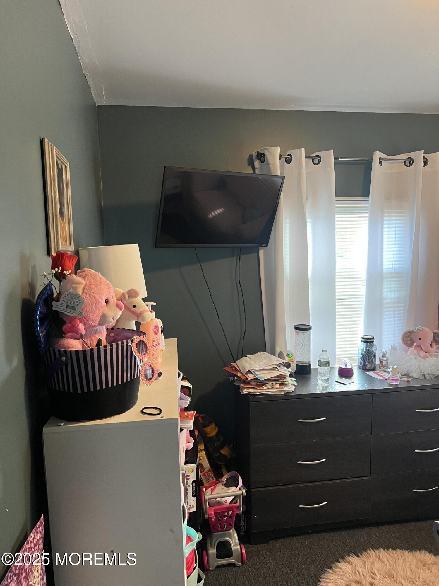 126 Leonard Avenue Neptune, NJ 07753 - Photo 18 of 27 a room with furniture and a mirror