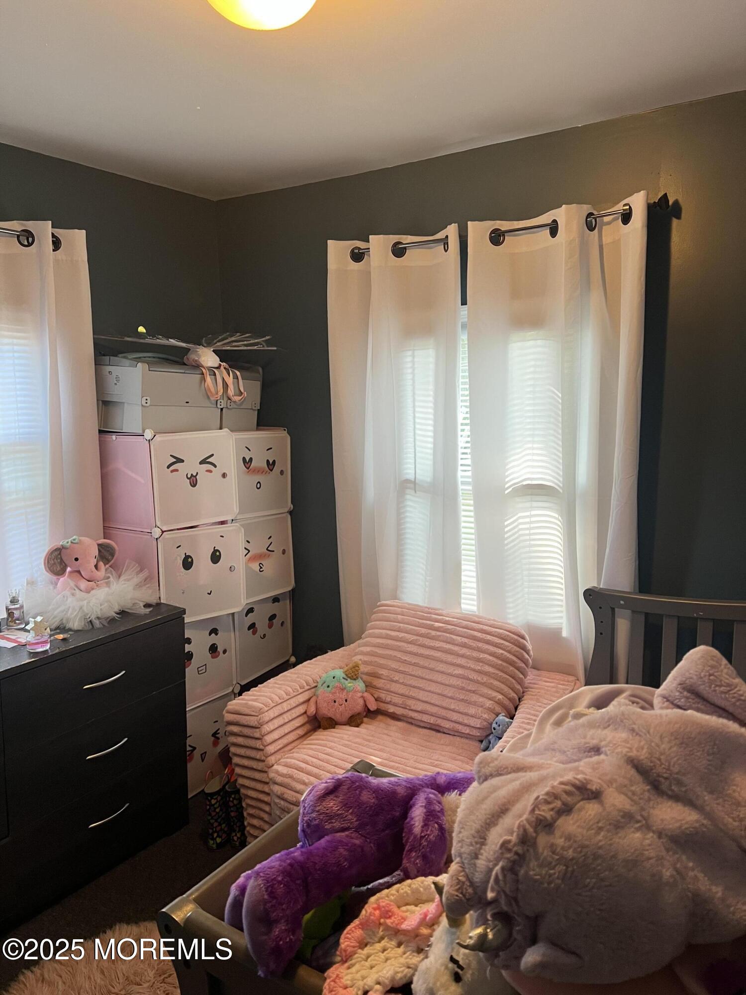 126 Leonard Avenue Neptune, NJ 07753 - Photo 20 of 27 a bedroom with a bed and a window