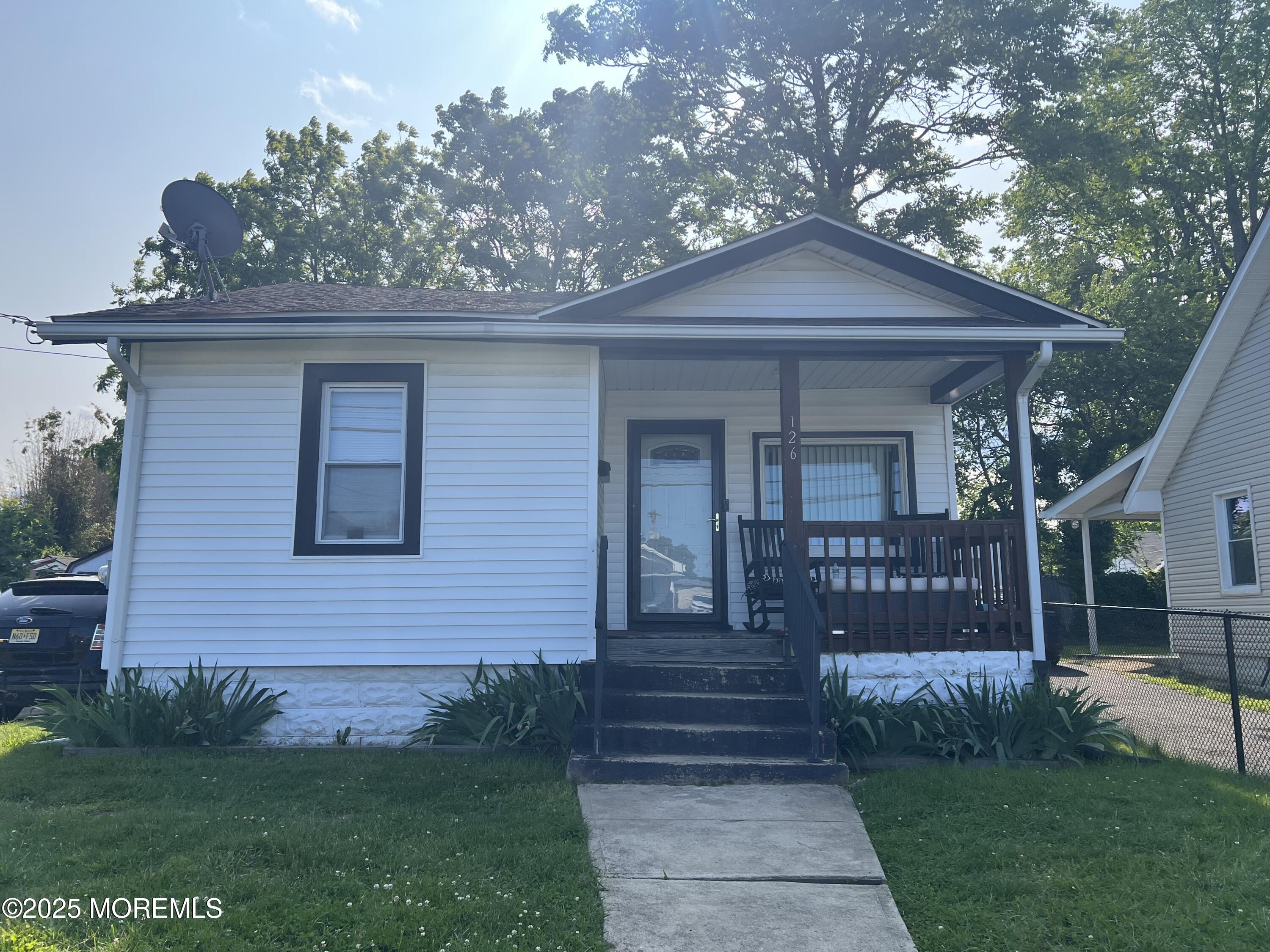 126 Leonard Avenue Neptune, NJ 07753 - Photo 2 of 27 a front view of a house with garden