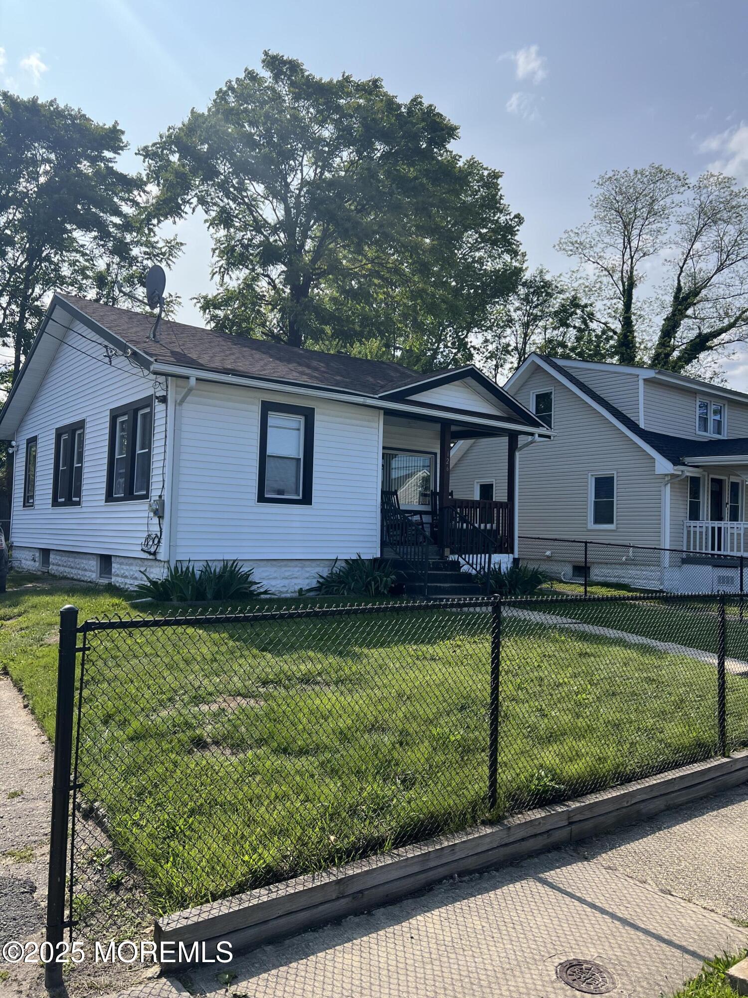 126 Leonard Avenue Neptune, NJ 07753 - Photo 25 of 27 a front view of a house with garden