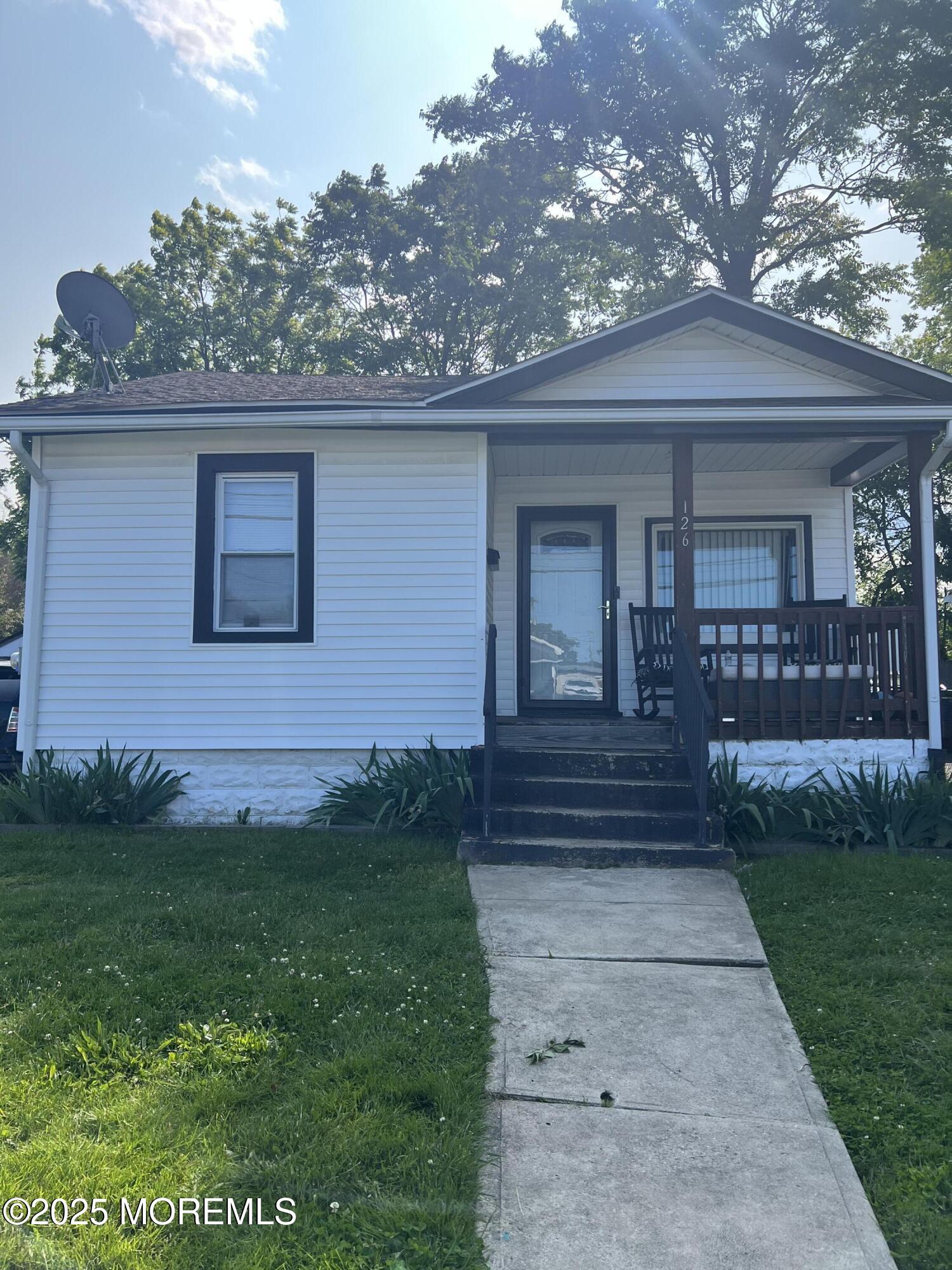126 Leonard Avenue Neptune, NJ 07753 - Photo 3 of 27 a front view of a house with garden