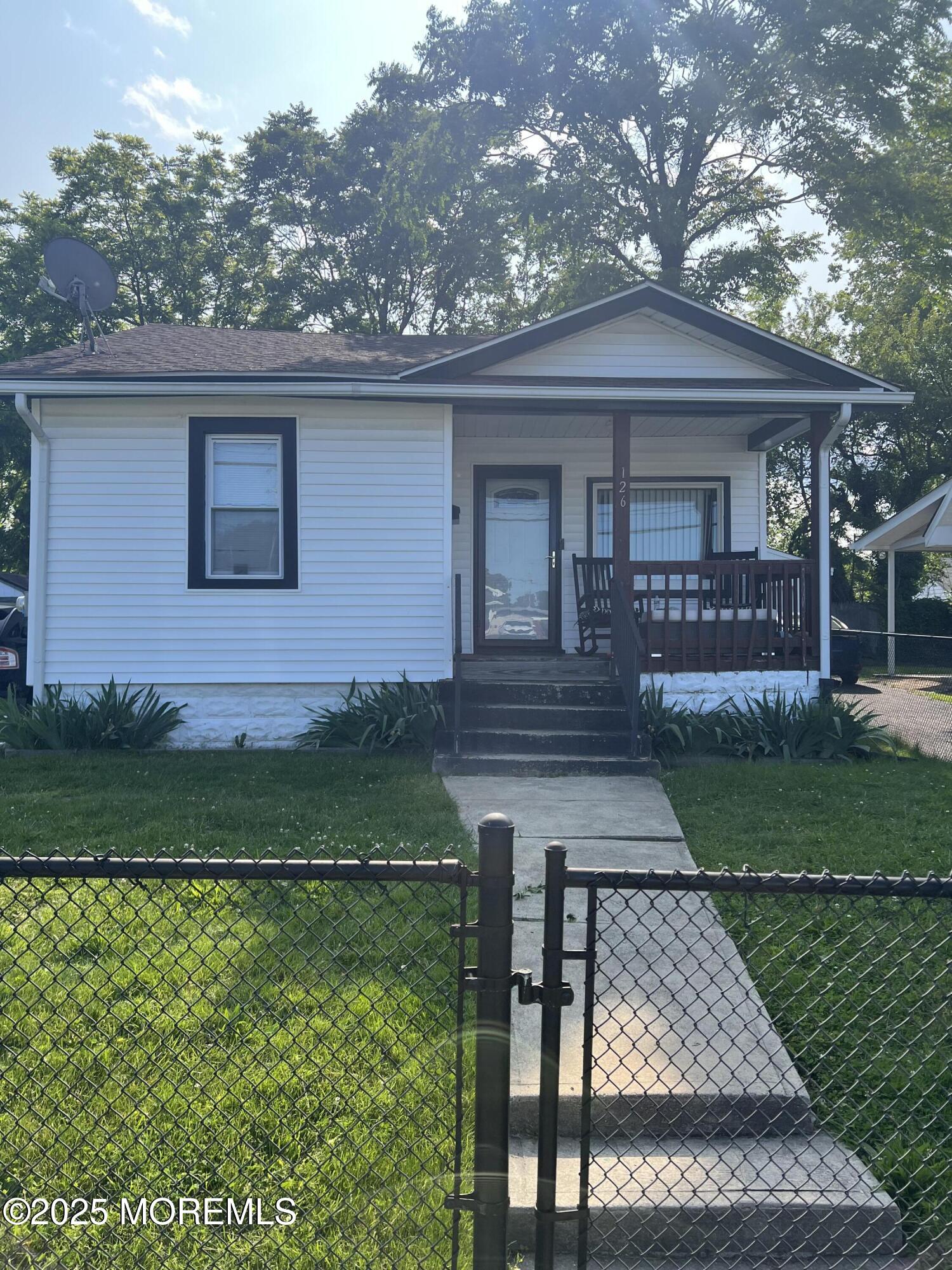 126 Leonard Avenue Neptune, NJ 07753 - Photo 4 of 27 a front view of a house with garden