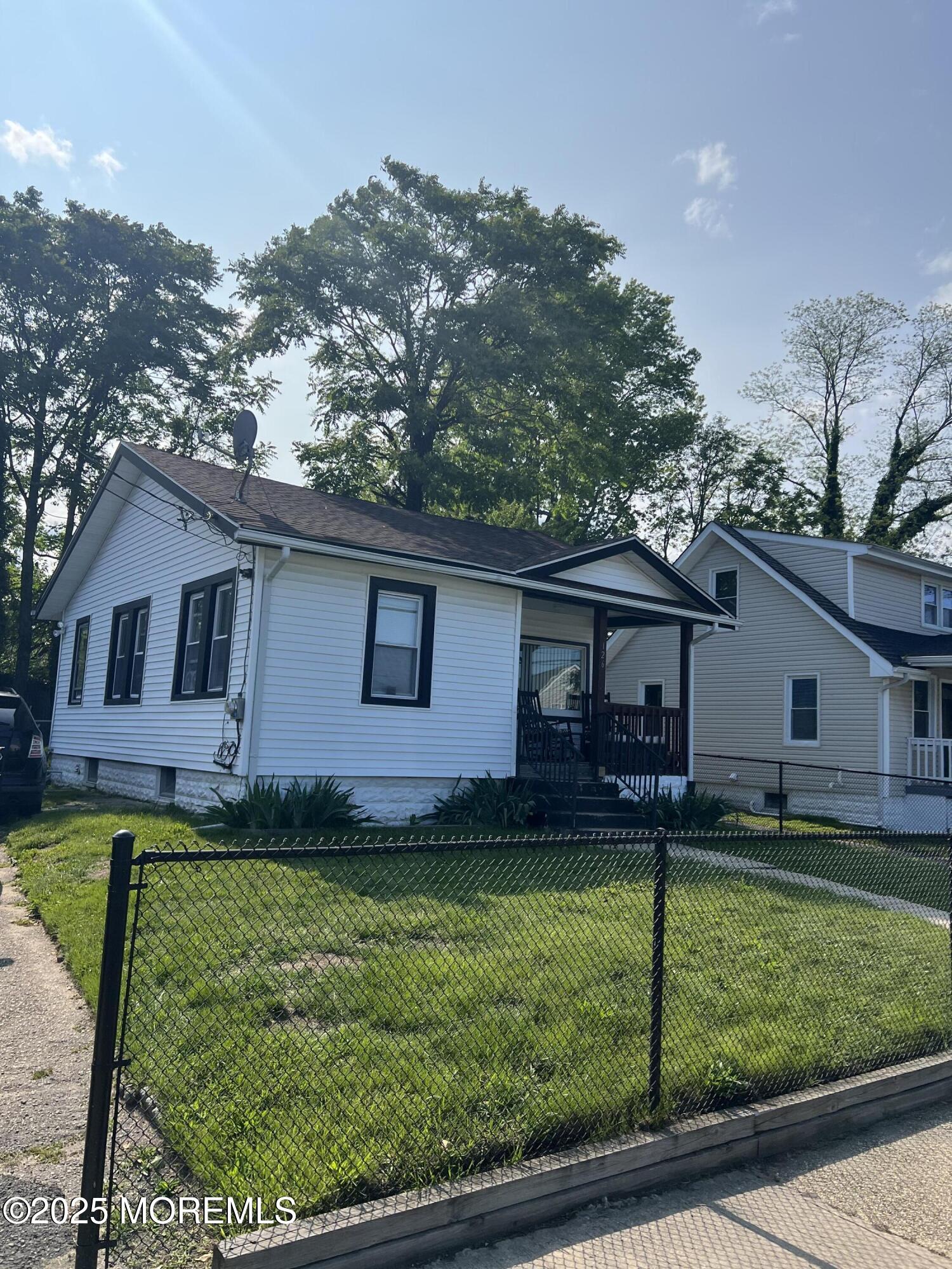 126 Leonard Avenue Neptune, NJ 07753 - Photo 7 of 27 a backyard of a house with lots of green space