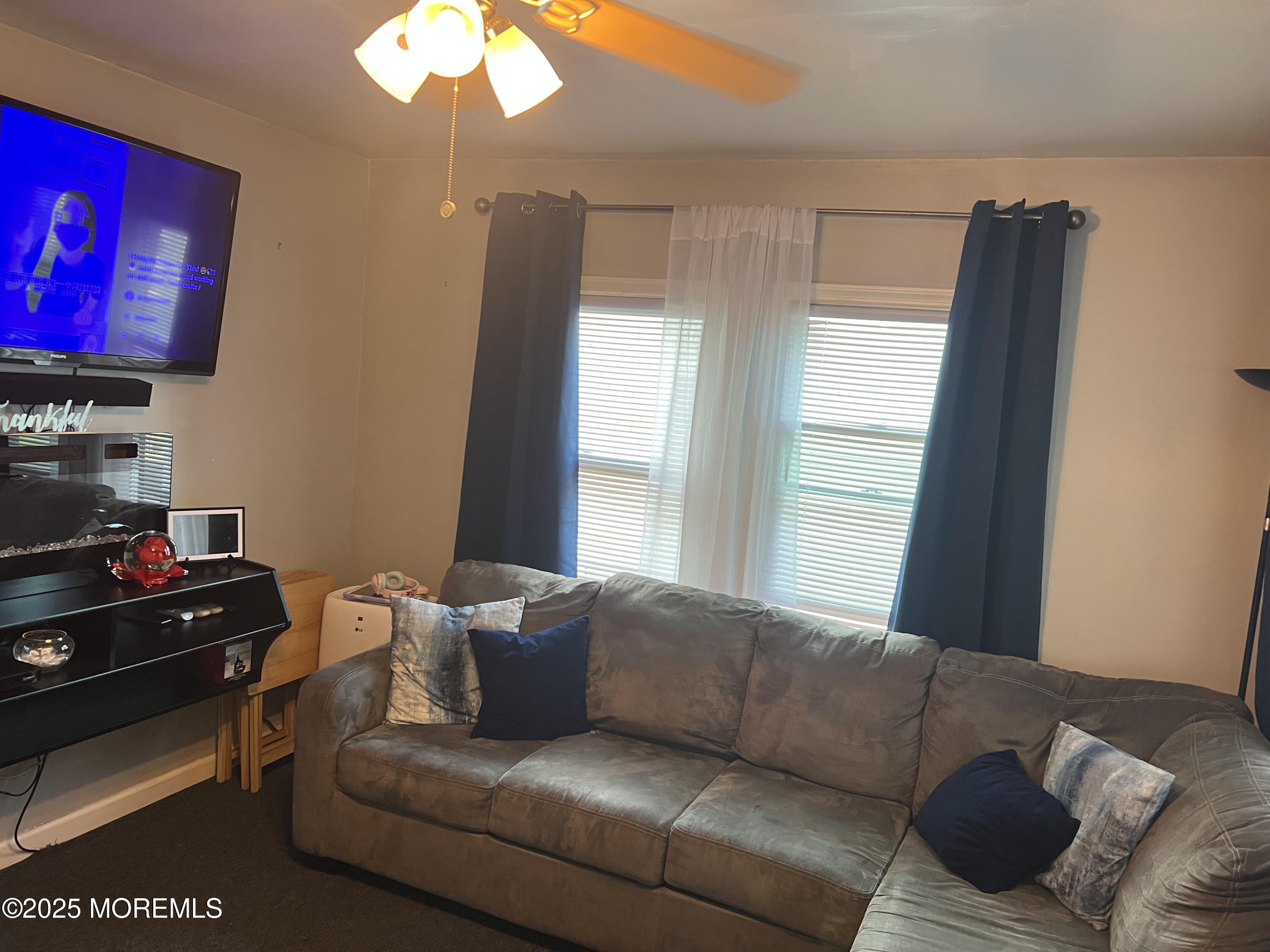 126 Leonard Avenue Neptune, NJ 07753 - Photo 10 of 27 a living room with furniture and a flat screen tv