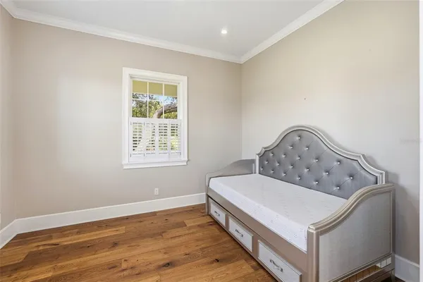 a porch with a table and chairs