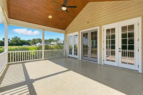 a view of dining room with furniture wooden floor and chandelier