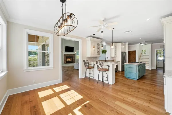 a kitchen with stainless steel appliances granite countertop wooden cabinets a stove and a granite counter tops
