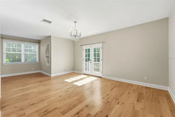a view of an empty room with a window