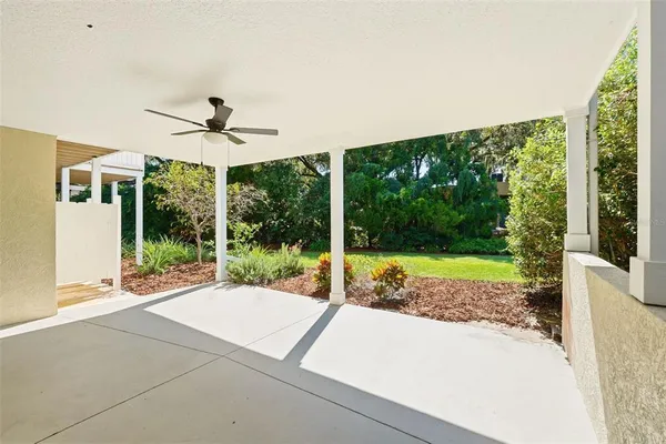 a aerial view of a house with swimming pool having outdoor seating