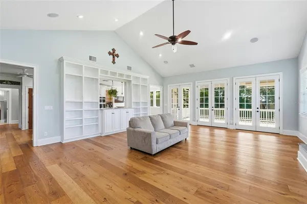 a living room with furniture fireplace and flat screen tv