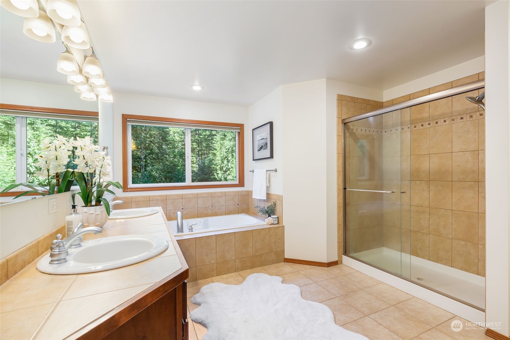 11227 Upper Preston Road Southeast Issaquah, WA 98027 - Photo 13 of 27 a bathroom with a bathtub and a sink