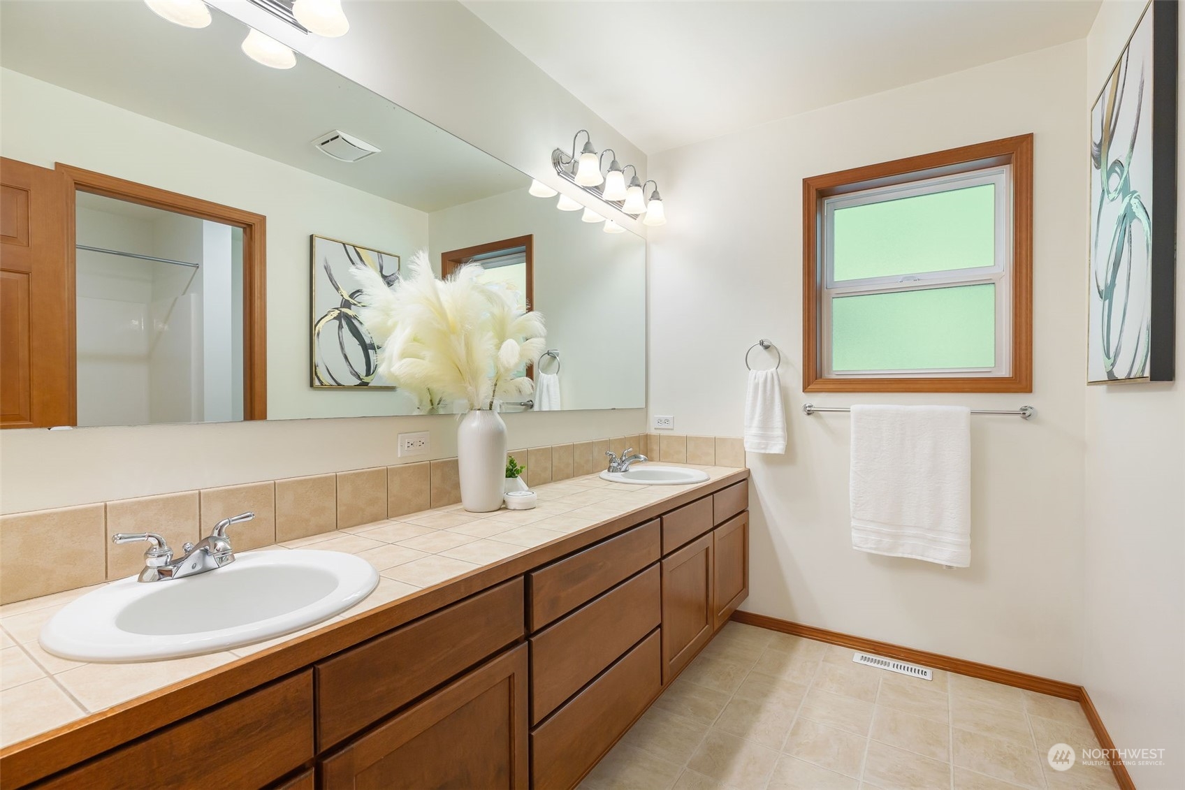 11227 Upper Preston Road Southeast Issaquah, WA 98027 - Photo 14 of 27 a bathroom with a sink and a mirror