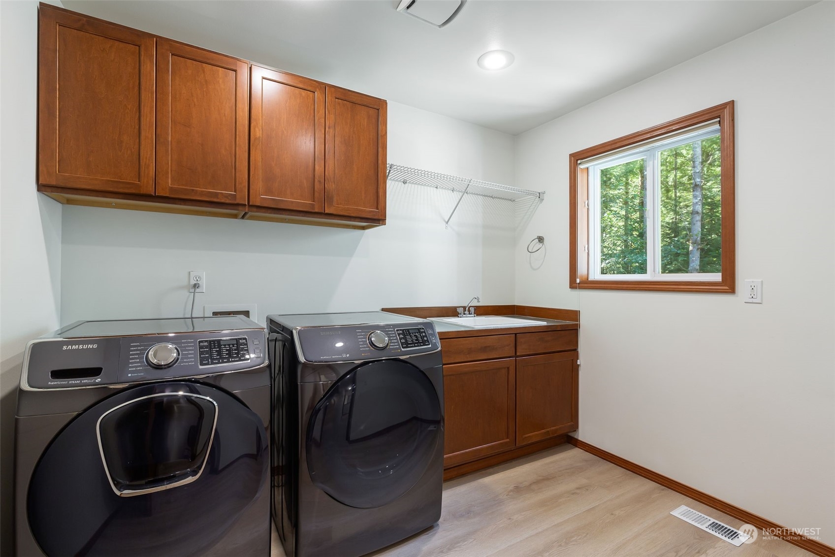 11227 Upper Preston Road Southeast Issaquah, WA 98027 - Photo 16 of 27 a utility room with sink dryer and washer