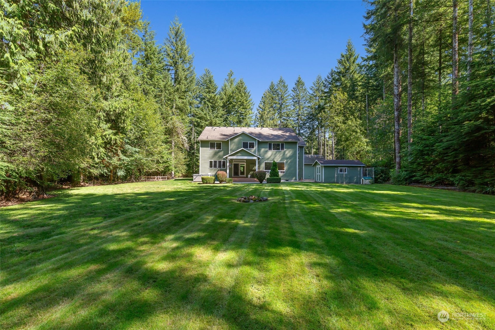 11227 Upper Preston Road Southeast Issaquah, WA 98027 - Photo 21 of 27 a view of a house with a backyard