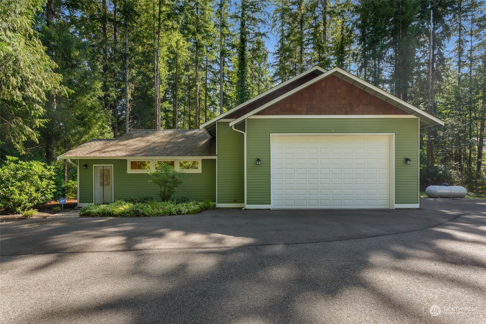 11227 Upper Preston Road Southeast Issaquah, WA 98027 - Photo 23 of 27 a front view of a house with a yard and garage
