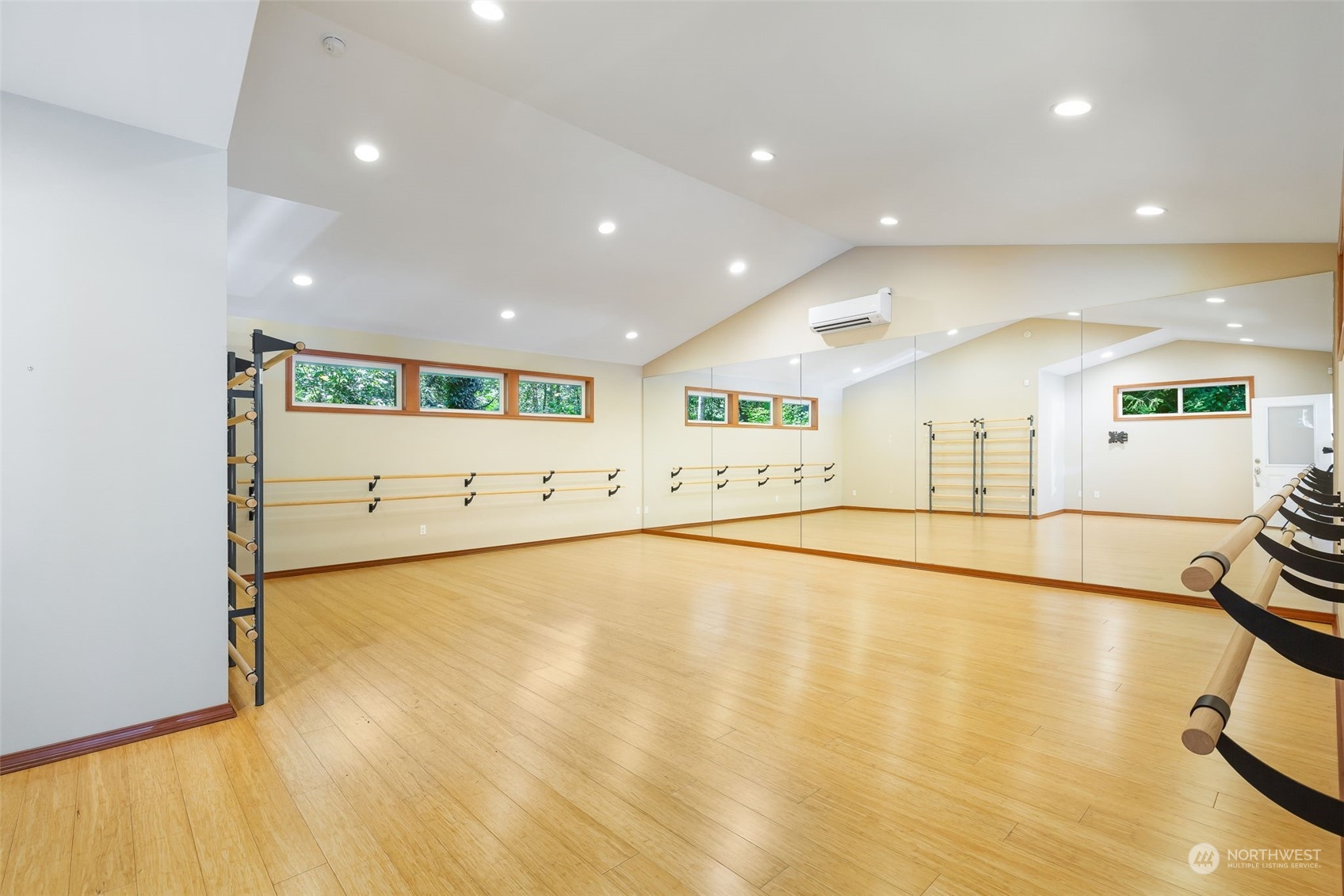11227 Upper Preston Road Southeast Issaquah, WA 98027 - Photo 24 of 27 a view of an empty room with wooden floor