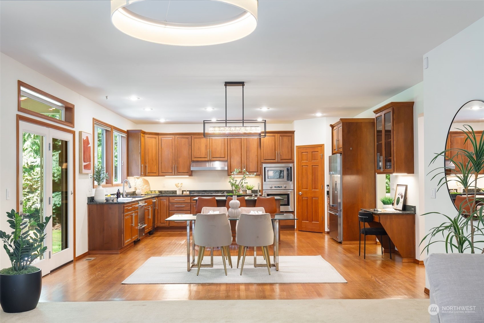 11227 Upper Preston Road Southeast Issaquah, WA 98027 - Photo 7 of 27 a dining room with furniture window and wooden floor