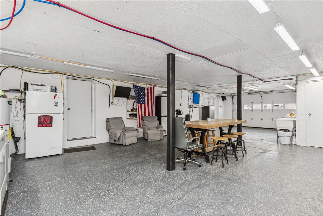 1602 Westboro Road Blanchester, OH 45107 - Photo 18 of 81 This spacious garage offers versatile space with durable flooring and overhead lighting.