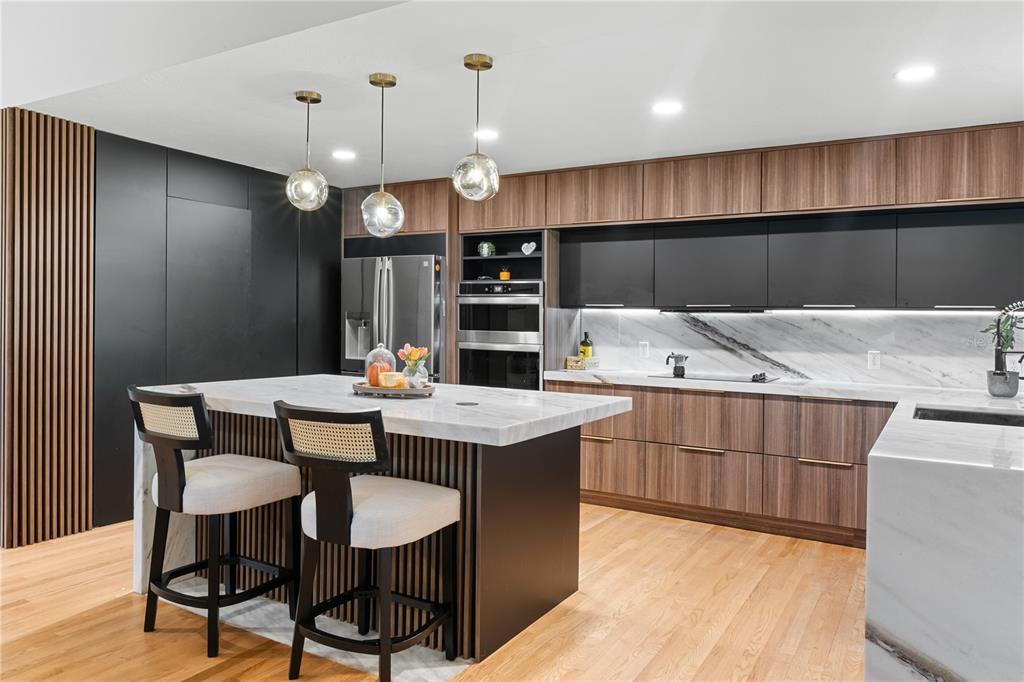 20107 Starry Street Orlando, FL 32833 - Photo 12 of 59 a kitchen with a dining table chairs and white cabinets