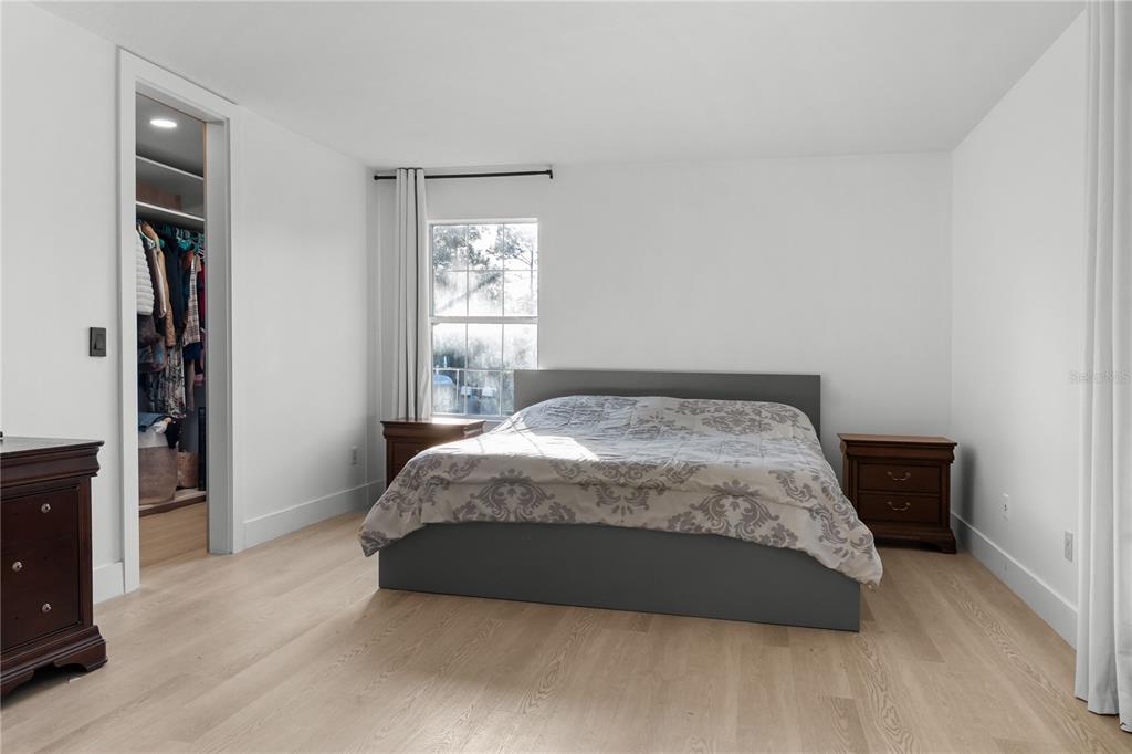 20107 Starry Street Orlando, FL 32833 - Photo 20 of 59 a bedroom with a bed and a window