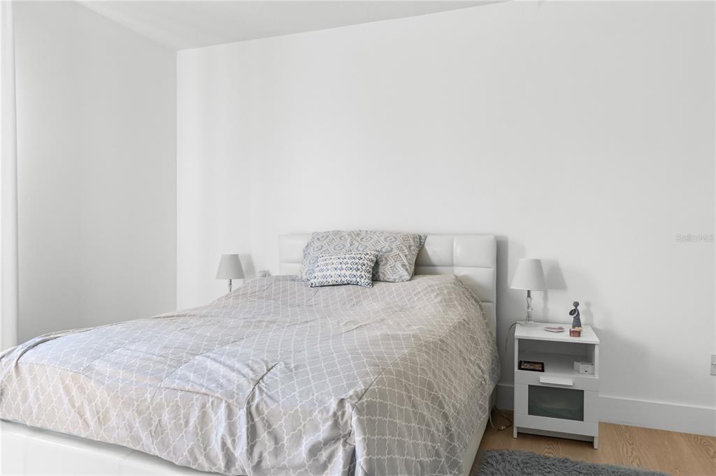 20107 Starry Street Orlando, FL 32833 - Photo 23 of 59 a bedroom with a bed and cabinets