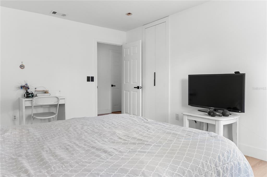 20107 Starry Street Orlando, FL 32833 - Photo 24 of 59 a bedroom with a bed and a flat screen tv