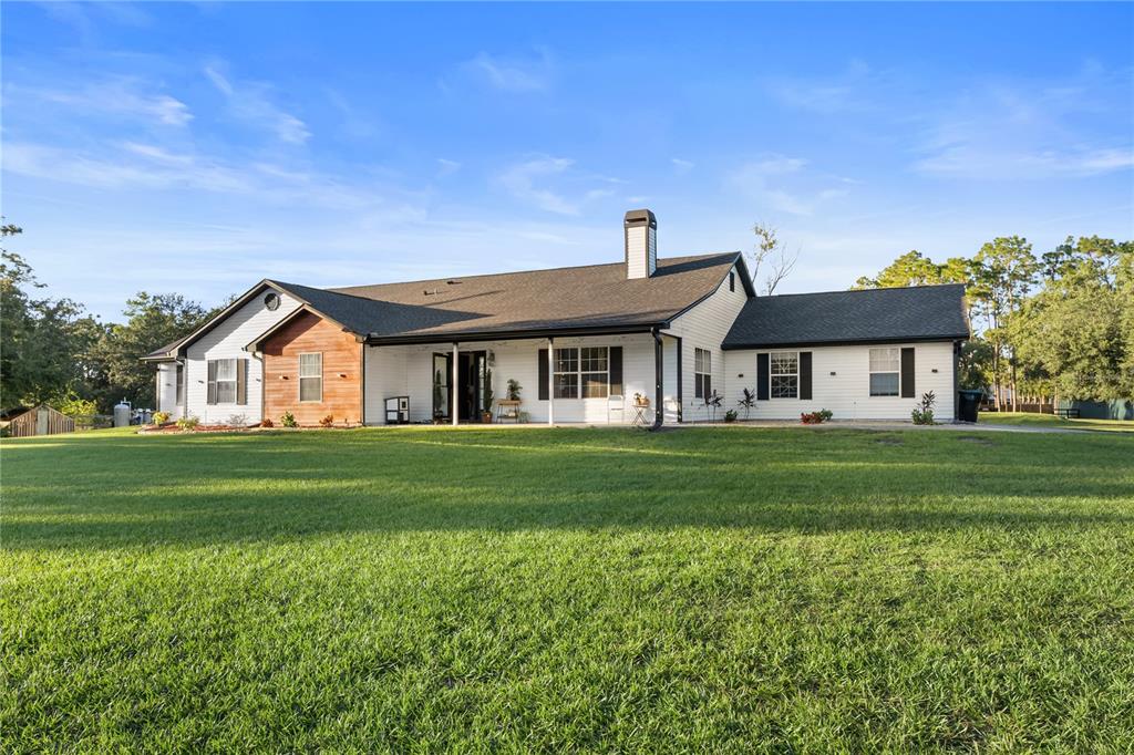 20107 Starry Street Orlando, FL 32833 - Photo 32 of 59 a front view of a house with a yard