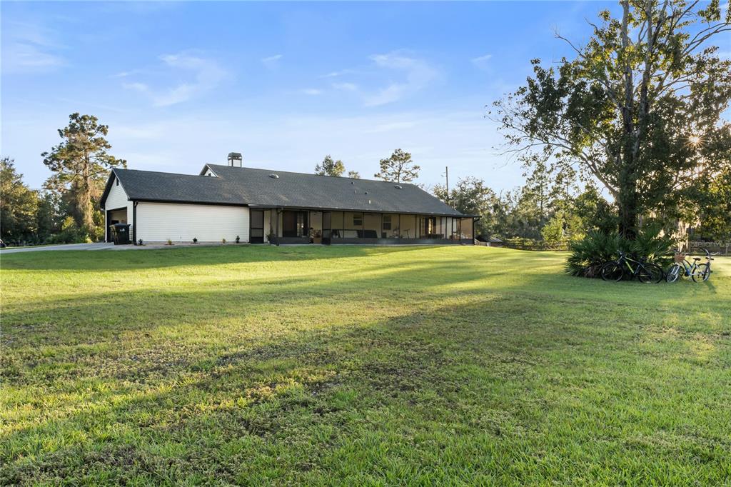 20107 Starry Street Orlando, FL 32833 - Photo 35 of 59 a view of a large garden with plants and large trees