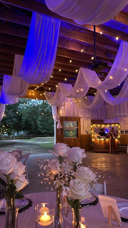 20107 Starry Street Orlando, FL 32833 - Photo 39 of 59 a view of a yard with table and chairs under an umbrella