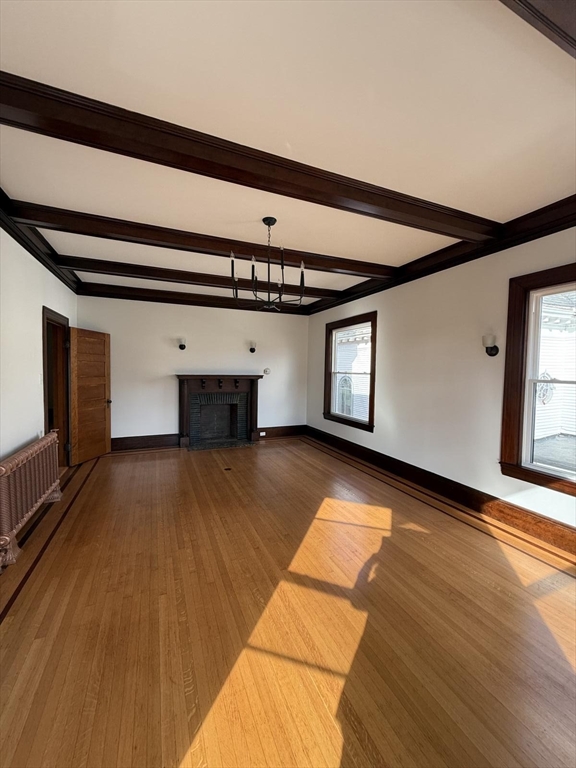 72 Belmont Street, Unit 1 Fall River, MA 02720 - Photo 13 of 20 a view of empty room with wooden floor and fan