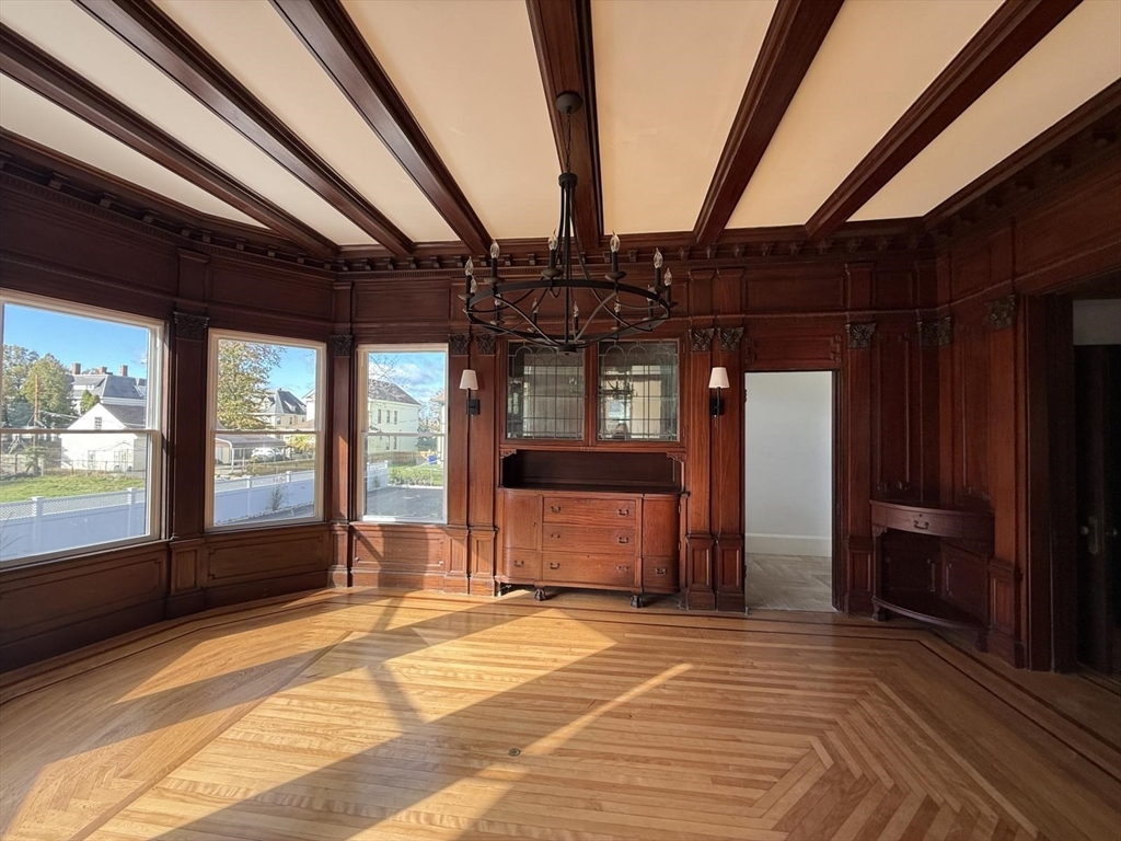 72 Belmont Street, Unit 1 Fall River, MA 02720 - Photo 4 of 20 a view of a room with wooden floor and windows