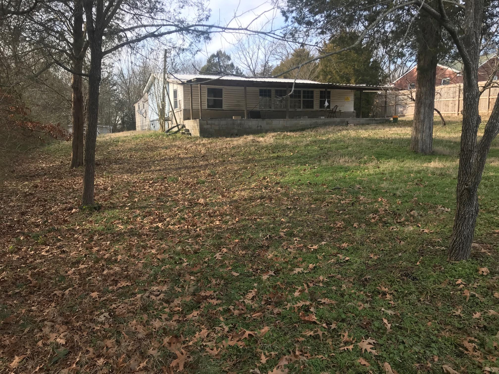 620 Larkin Springs Road Madison, TN 37115 - Photo 3 of 5 a front view of a house with a yard